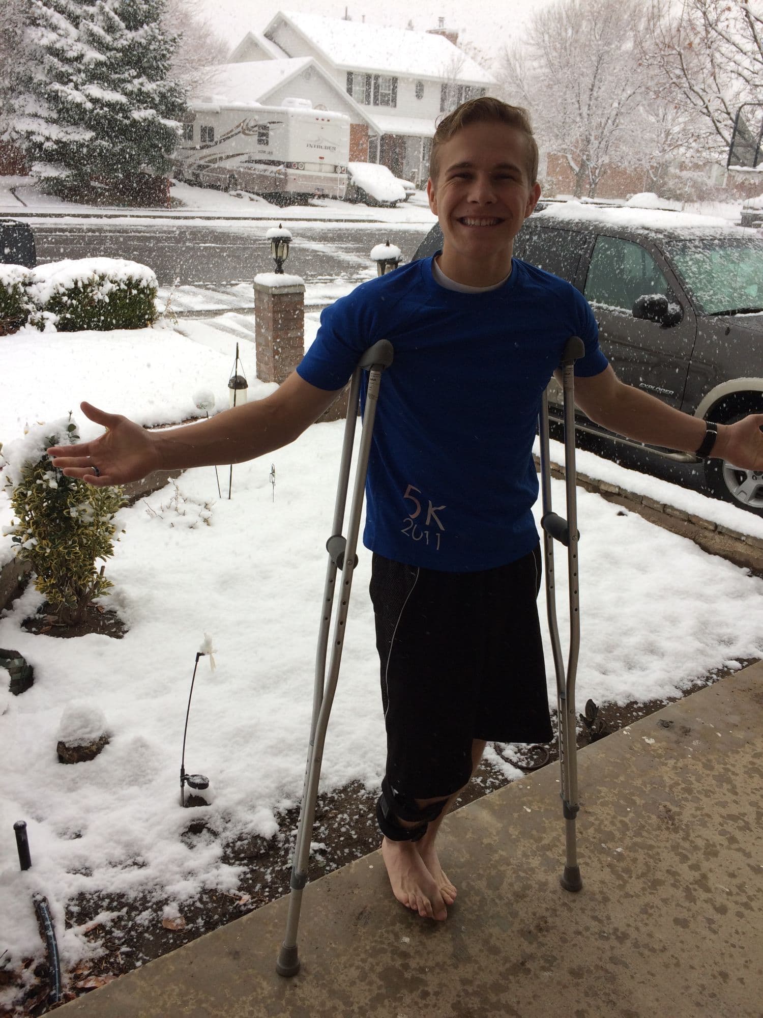 Marshall on crutches in the snow after one of his knee surgeries